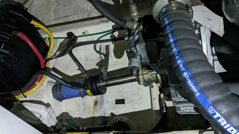 Sea Ranger Yacht Photos Pics Engine compartment of a 2008 Sabre 34 Express boat showing mechanical components and hoses.