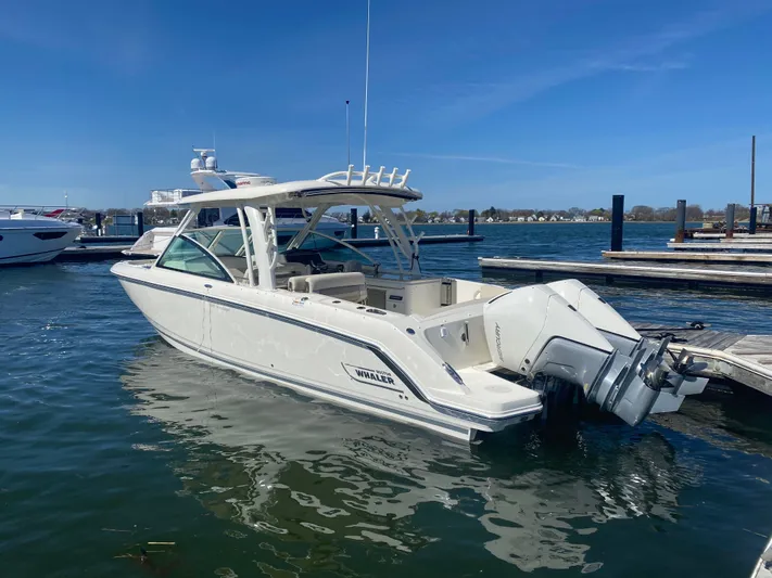  Yacht Photos Pics Boston Whaler 320 Vantage 2020 docked on a sunny day.