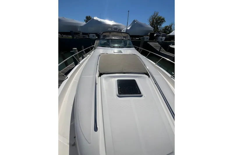 A Friend Like Me Yacht Photos Pics 2000 Sea Ray 460 Sundancer yacht, docked, with sunpad and hatch on deck.