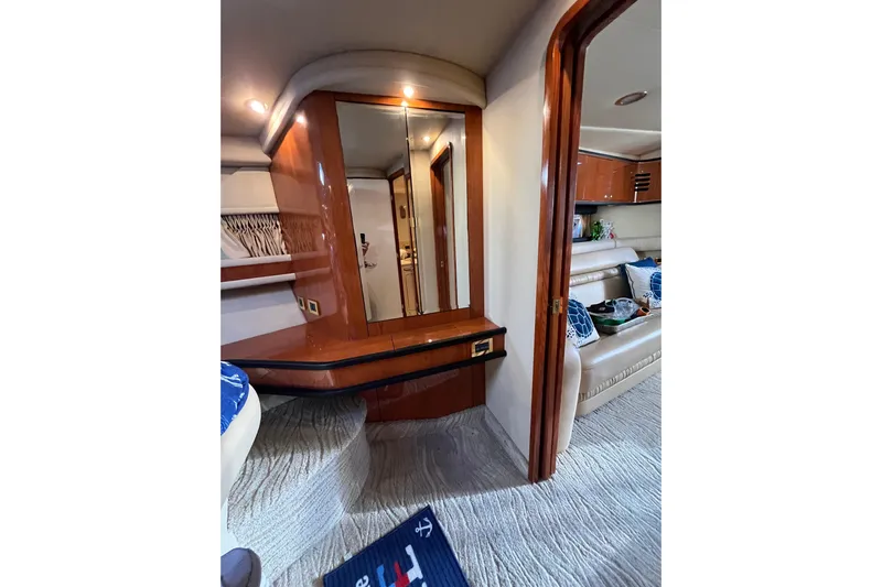 A Friend Like Me Yacht Photos Pics Interior of 2000 Sea Ray 460 Sundancer yacht with elegant wood finish and cozy seating.