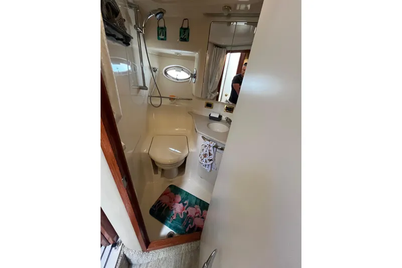 A Friend Like Me Yacht Photos Pics Bathroom interior of 2000 Sea Ray 460 Sundancer yacht with shower and toilet.