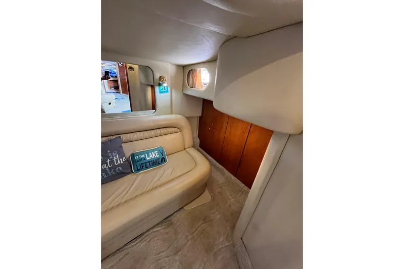 A Friend Like Me Yacht Photos Pics Interior of 2000 Sea Ray 460 Sundancer with beige seating and decorative pillows.