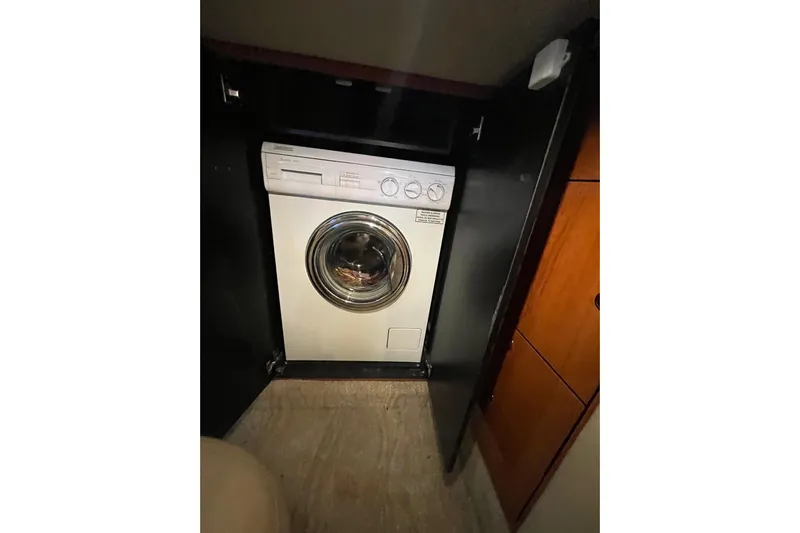 A Friend Like Me Yacht Photos Pics Washing machine inside 2000 Sea Ray 460 Sundancer yacht cabin.