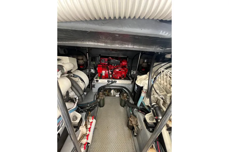 A Friend Like Me Yacht Photos Pics Engine room of 2000 Sea Ray 460 Sundancer with visible machinery and components.