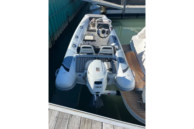 A Friend Like Me Yacht Photos Pics Inflatable boat docked beside a Sea Ray 460 Sundancer, 2000 model.