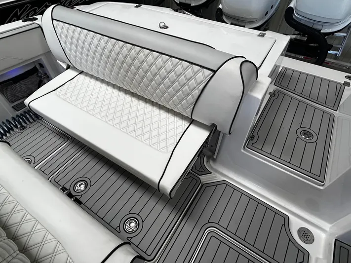  Yacht Photos Pics 2016 Nor-Tech 390 Sport boat interior with quilted seating and sleek deck design.
