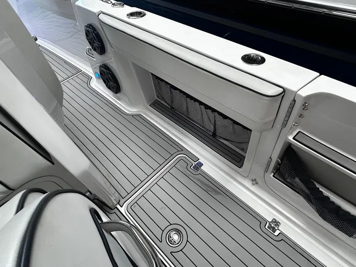  Yacht Photos Pics 2016 Nor-Tech 390 Sport boat interior with sleek deck and storage compartments.