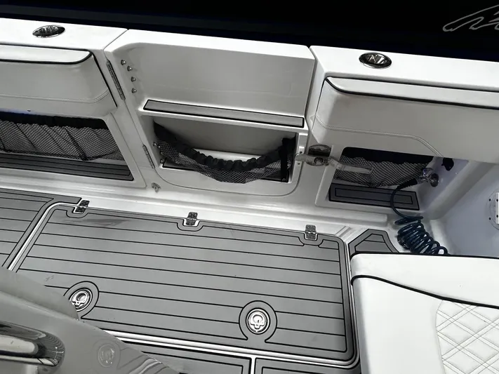  Yacht Photos Pics 2016 Nor-Tech 390 Sport boat interior with sleek storage compartments and modern design.