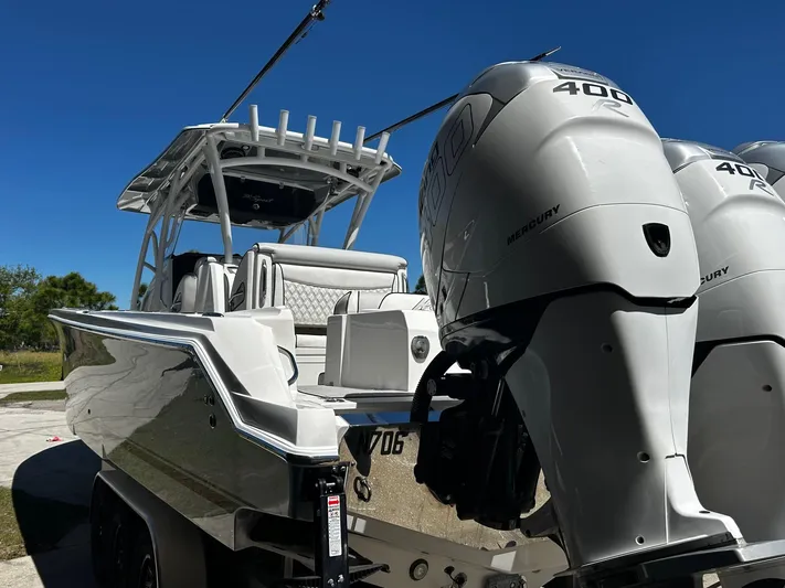  Yacht Photos Pics 2016 Nor-Tech 390 Sport boat with dual Mercury 400 engines, parked on a trailer.