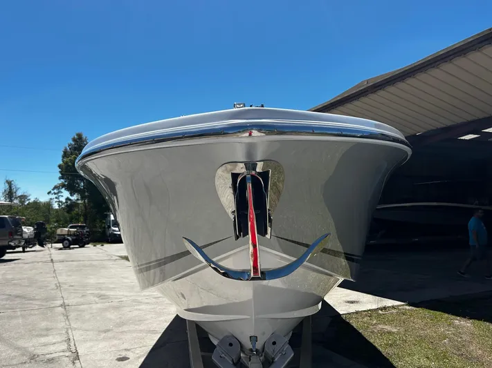  Yacht Photos Pics 2016 Nor-Tech 390 Sport boat, front view, parked outdoors under clear blue sky.