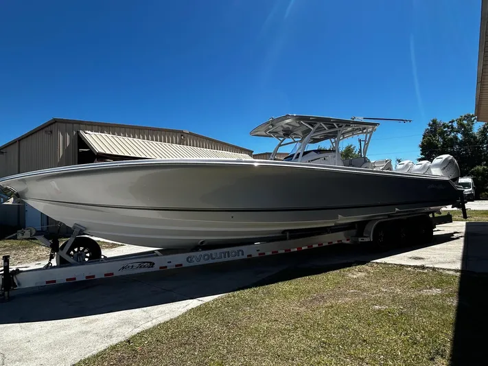  Yacht Photos Pics 2016 Nor-Tech 390 Sport boat on trailer under clear blue sky.