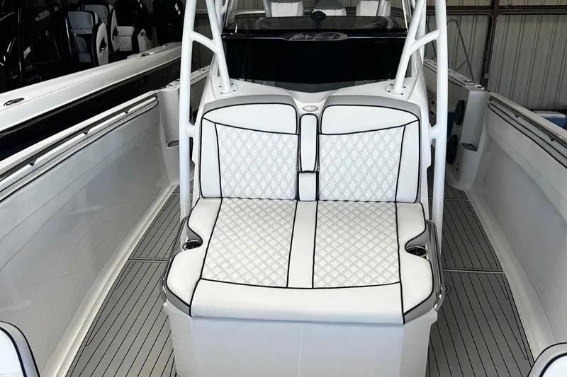  Yacht Photos Pics 2016 Nor-Tech 390 Sport boat interior with white quilted seating and sleek design.