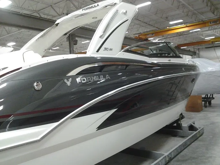 Banchors Ours Yacht Photos Pics 2018 Formula 310 Bowrider boat in a showroom, showcasing sleek design and modern features.