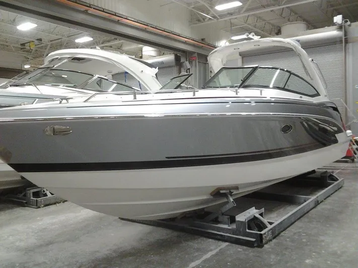 Banchors Ours Yacht Photos Pics 2018 Formula 310 Bowrider boat in indoor storage facility.