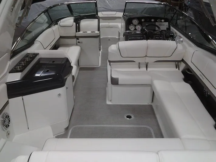 Banchors Ours Yacht Photos Pics 2018 Formula 310 Bowrider interior with luxurious white seating and modern dashboard.