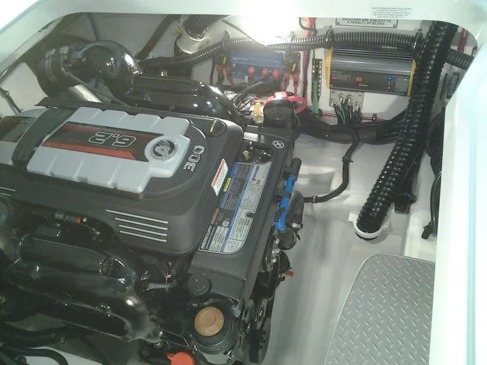 Banchors Ours Yacht Photos Pics Engine compartment of a 2018 Formula 310 Bowrider boat, showcasing a powerful engine setup.