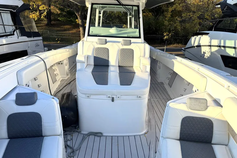 Fansea Pantz Yacht Photos Pics 2019 HCB 39 Speciale boat interior with white and gray seating, docked outdoors.