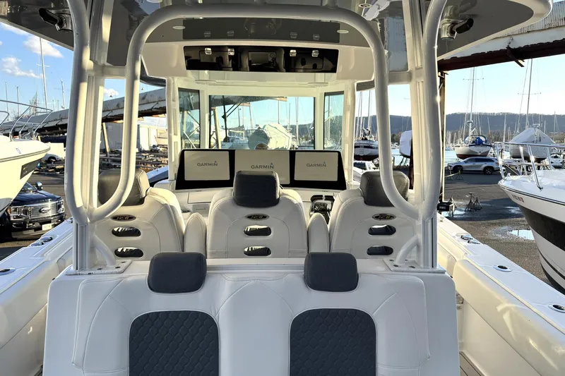 Fansea Pantz Yacht Photos Pics 2019 HCB 39 Speciale boat interior with Garmin displays, white seating, and marina background.
