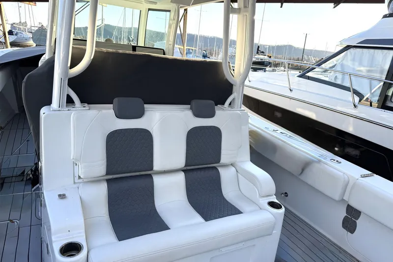 Fansea Pantz Yacht Photos Pics 2019 HCB 39 Speciale boat interior with white and gray seating at a marina.
