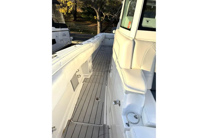 Fansea Pantz Yacht Photos Pics 2019 HCB 39 Speciale boat interior with sleek white seating and wood-style flooring.