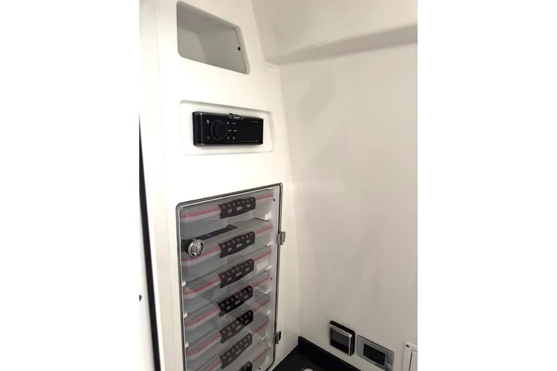 Fansea Pantz Yacht Photos Pics 2019 HCB 39 Speciale interior storage with organized compartments and control panel.