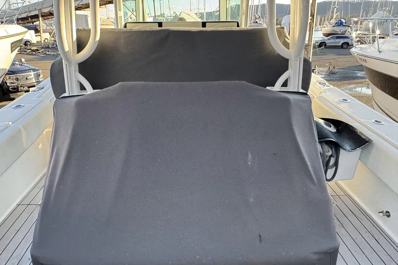 Fansea Pantz Yacht Photos Pics 2019 HCB 39 Speciale boat with covered seating, docked at a marina.