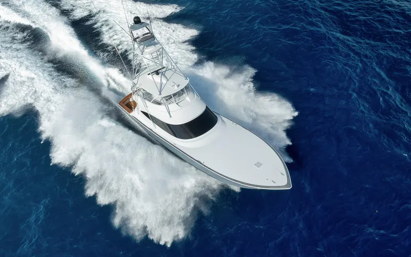 Lady Surfbum Yacht Photos Pics 2024 Viking 72 Convertible yacht cruising swiftly on open blue ocean waters.