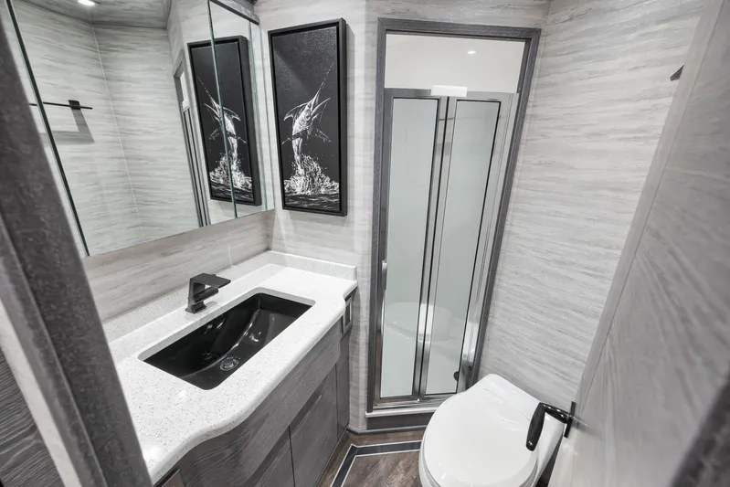 Lady Surfbum Yacht Photos Pics Luxurious bathroom in 2024 Viking 72 Convertible yacht with modern fixtures and elegant design.