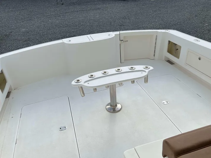  Yacht Photos Pics Henriques 50 Sportfisherman 2021 boat deck with rod holders and storage compartments.