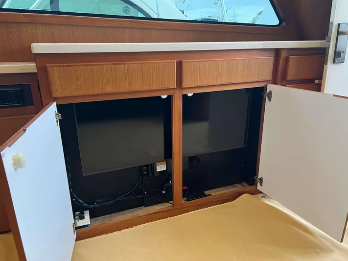  Yacht Photos Pics Open cabinet doors on a 2021 Henriques 50 Sportfisherman boat.