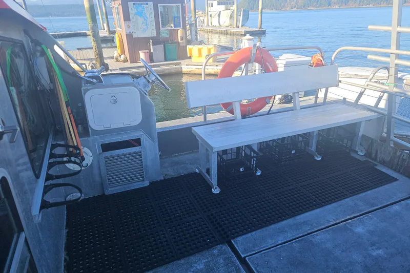 Gig Yacht Photos Pics Boat interior with bench seating, steering wheel, and life preserver, Custom SMW 38, 1994 model.