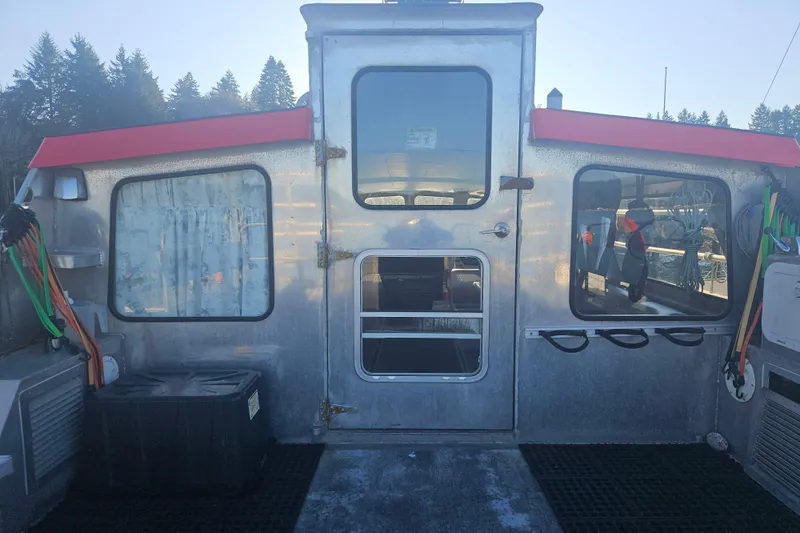 Gig Yacht Photos Pics Custom SMW 38 boat cabin, 1994 model, with metal exterior and red accents.