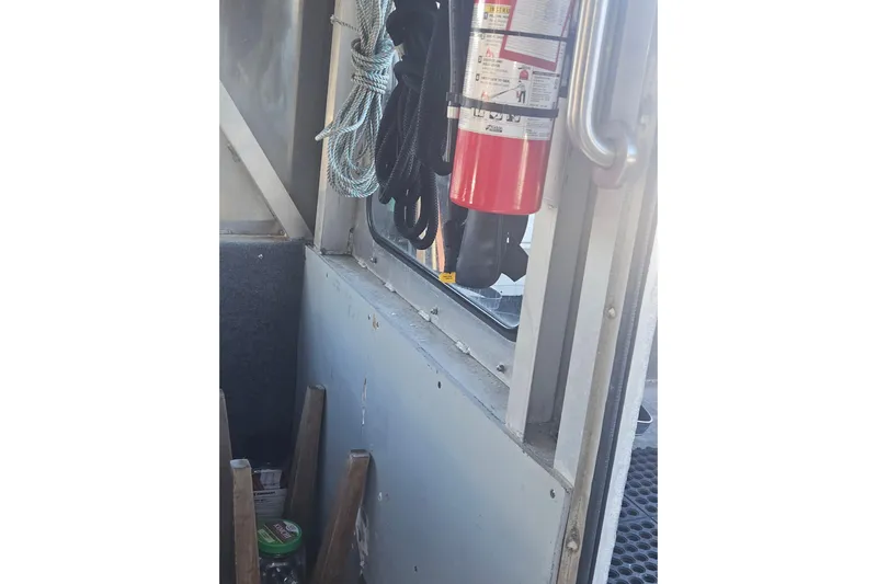 Gig Yacht Photos Pics Interior of a 1994 Custom SMW 38 with fire extinguisher and coiled ropes.