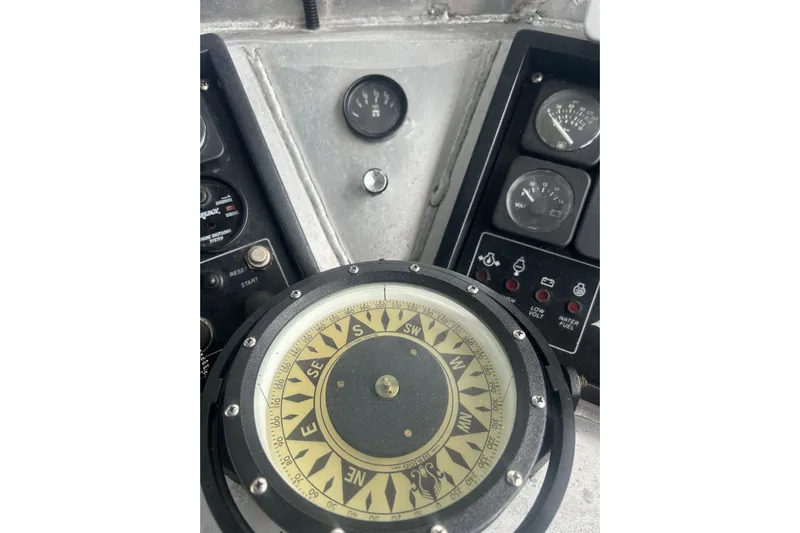 Gig Yacht Photos Pics Close-up of Svendsen Marine Works SMW 38 boat compass and control panel, 1994 model.