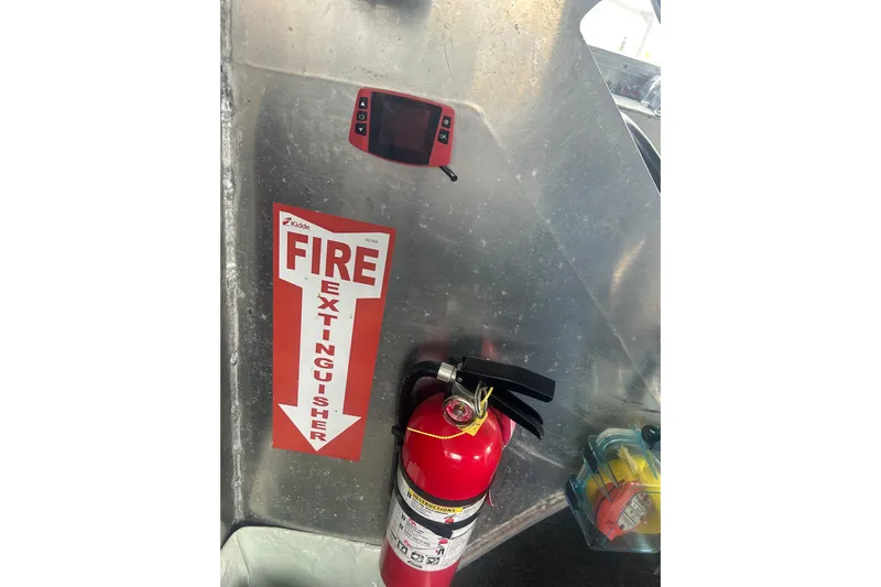 Gig Yacht Photos Pics Fire extinguisher on Svendsen Marine Works SMW 38, 1994 model, with safety signage.