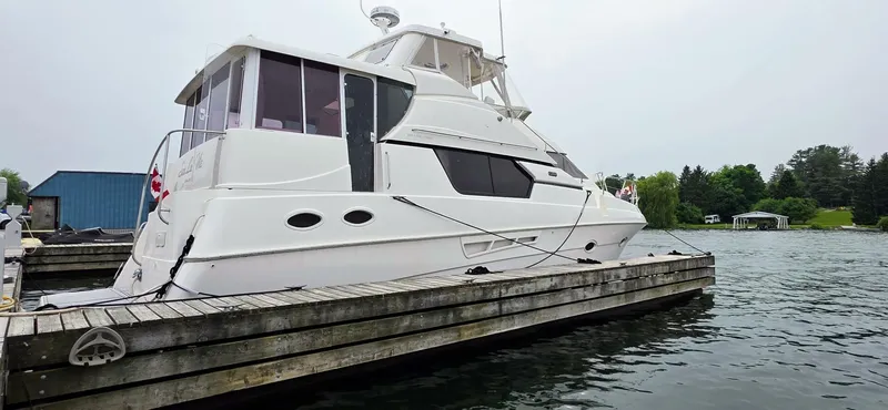  Yacht Photos Pics 2000 Silverton 453MY yacht docked at a marina, side view.