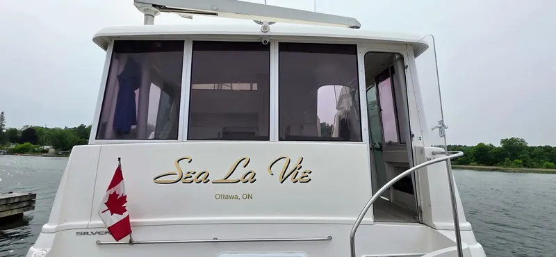  Yacht Photos Pics 2000 Silverton 453MY yacht "Sea La Vie" with Canadian flag, docked in Ottawa, ON.