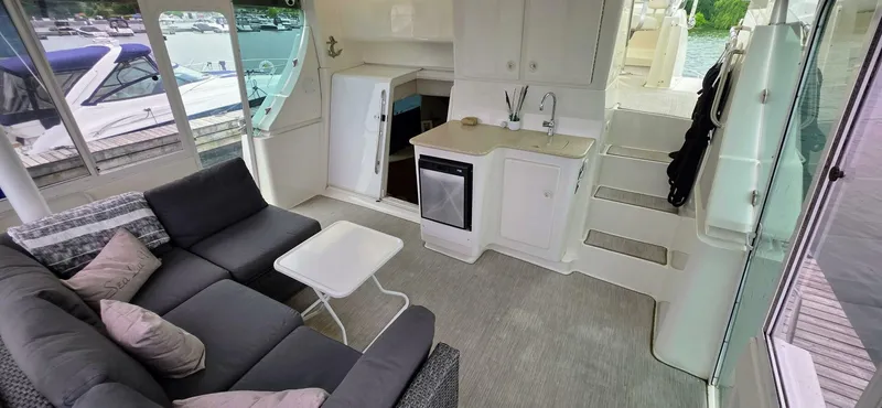  Yacht Photos Pics Luxurious interior of 2000 Silverton 453MY yacht with seating and kitchenette.