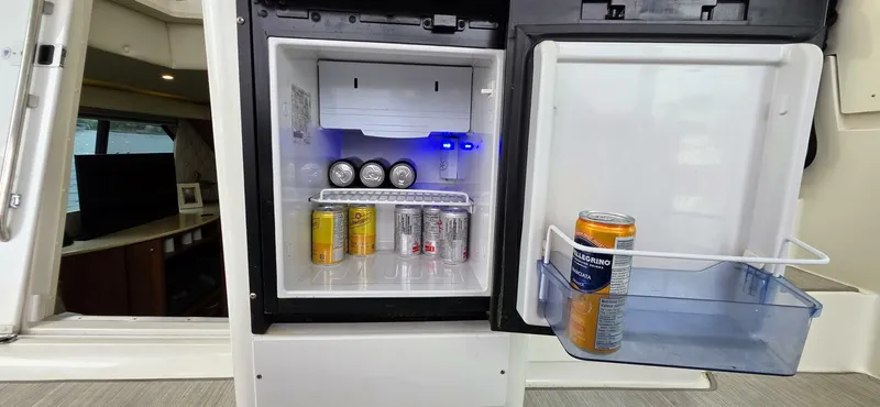  Yacht Photos Pics Mini fridge stocked with beverages on a 2000 Silverton 453MY yacht.