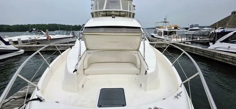  Yacht Photos Pics 2000 Silverton 453MY yacht docked at marina, featuring spacious deck and seating area.