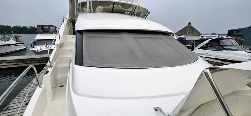  Yacht Photos Pics 2000 Silverton 453MY yacht docked at marina, featuring sleek design and spacious deck.