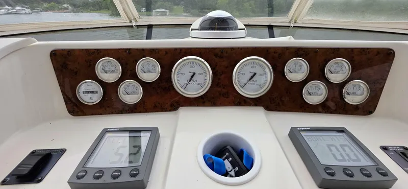  Yacht Photos Pics Dashboard of a 2000 Silverton 453MY yacht with gauges and digital displays.