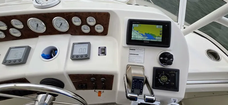  Yacht Photos Pics Helm of 2000 Silverton 453MY yacht with navigation instruments and controls.