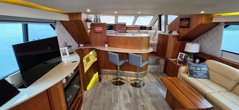  Yacht Photos Pics Luxurious interior of 2000 Silverton 453MY yacht with modern furnishings and panoramic windows.