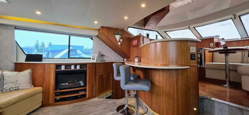  Yacht Photos Pics Luxurious interior of 2000 Silverton 453MY yacht with modern furnishings and elegant wood finishes.