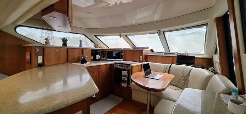  Yacht Photos Pics Luxurious interior of 2000 Silverton 453MY yacht with modern kitchen and seating area.