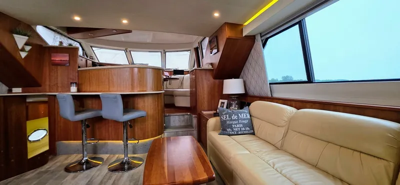  Yacht Photos Pics Luxurious interior of 2000 Silverton 453MY yacht with modern seating and elegant wood finishes.