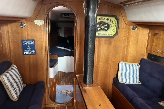 G Force Yacht Photos Pics Interior of 2004 J Boats J/133 sailboat with cozy seating and nautical decor.