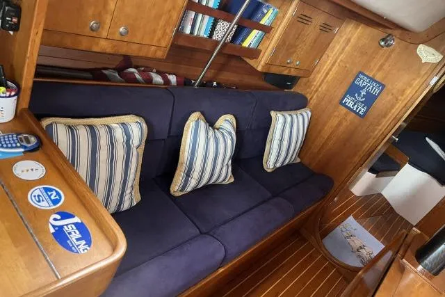 G Force Yacht Photos Pics Interior of 2004 J Boats J/133 with cozy seating and nautical decor.