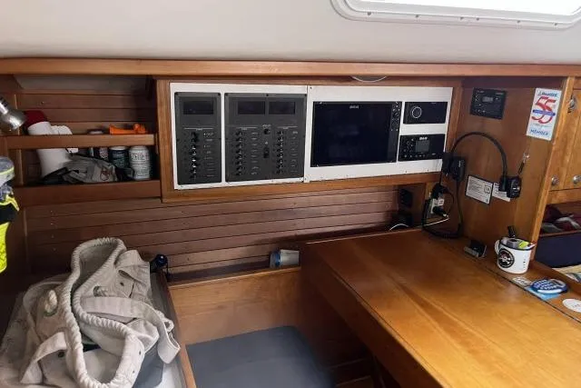 G Force Yacht Photos Pics 2004 J Boats J/133 yacht interior with navigation equipment and wooden cabinetry.